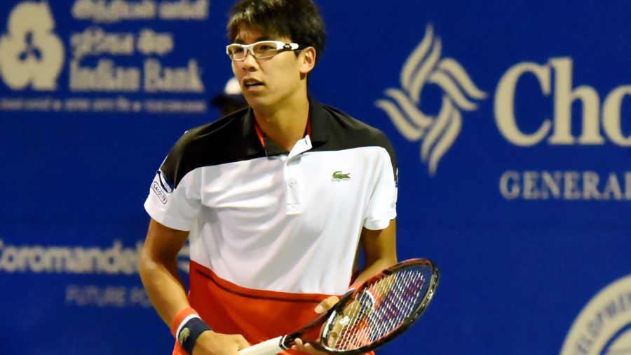 Chung Hyeon of South Korea plays against Dudi Sela of Israel in a second round match at Aircel Chennai Open tournament at SDAT Tennis Stadium in Chennai