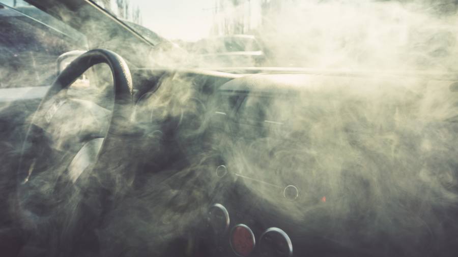 Car interior in smoke or vapour. Vape Inside car. Can be used as fire in automobile